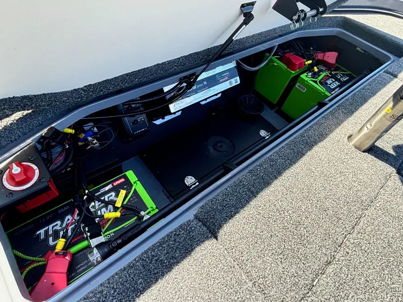 Slide: The Image of 2023 Ranger Z521R boat battery compartment with Tracker batteries and wiring. - 15