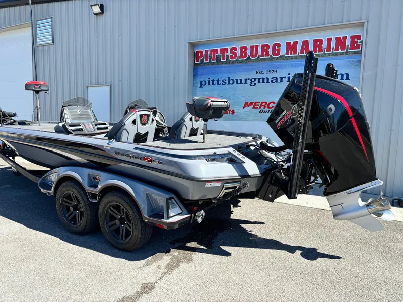 Slide: The Image of 2023 Ranger Z521R boat at Pittsburg Marine dealership, featuring sleek design and powerful engine. - 16