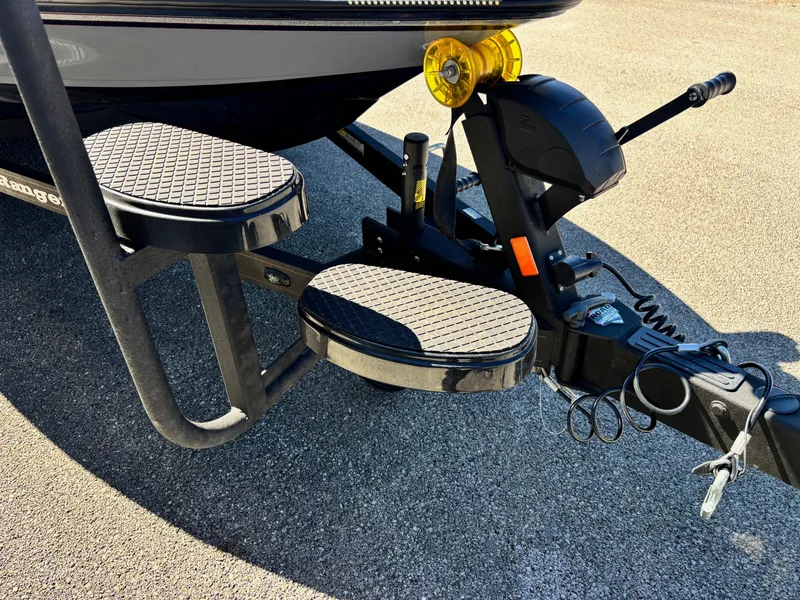 Slide: The Image of 2023 Ranger Z521R boat trailer with dual step platform and hitch mechanism. - 2