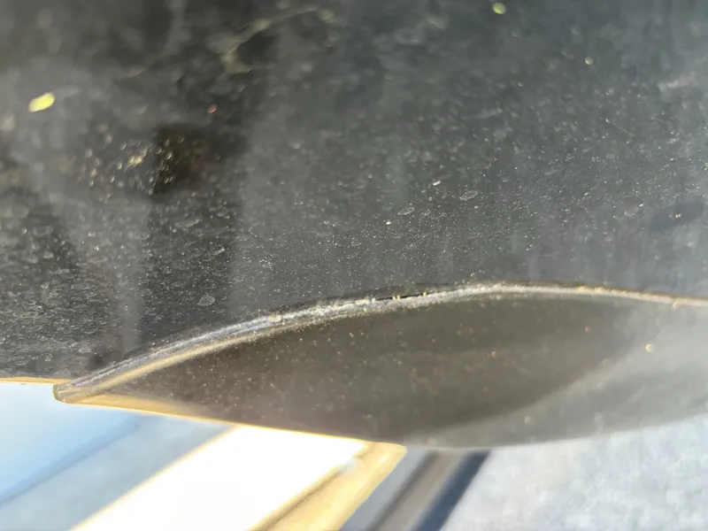 Slide: The Image of Close-up of a 2023 Ranger Z521R boat hull, showing surface texture and detail. - 4