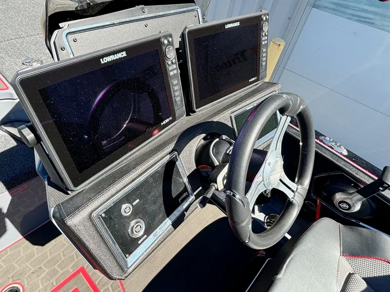 Slide: The Image of 2023 Ranger Z521R boat dashboard with dual Lowrance displays and steering wheel. - 9