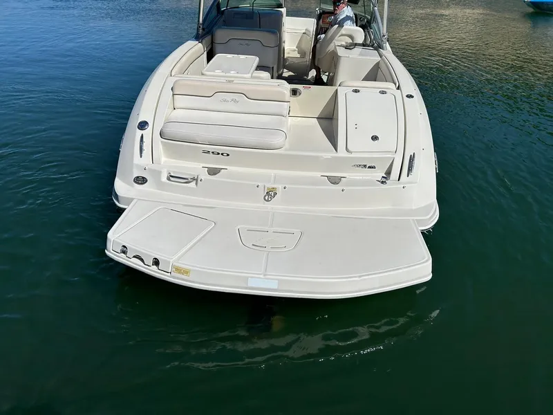 Slide: The Image of 2008 Sea Ray 290 Sundeck boat on water, rear view showing spacious deck and seating. - 19