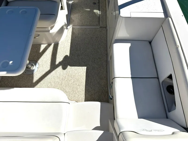 Slide: The Image of Interior of 2008 Sea Ray 290 Sundeck with white seating and table. - 24