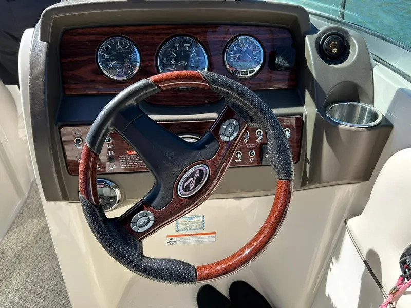 Slide: The Image of Steering wheel and dashboard of 2008 Sea Ray 290 Sundeck boat. - 39