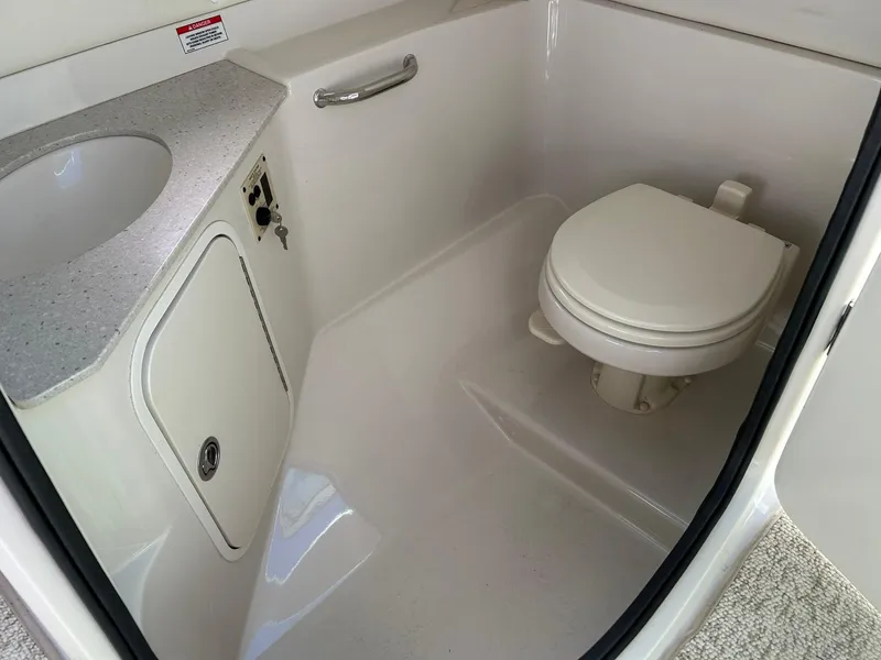 Slide: The Image of 2008 Sea Ray 290 Sundeck boat bathroom with toilet and sink. - 44