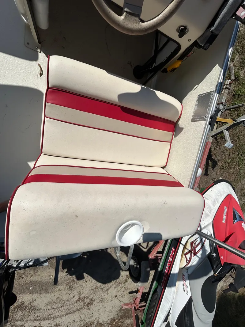 Slide: The Image of 2008 Fiesta Fish n Fun 16 Deluxe boat seat with red and white upholstery. - 12
