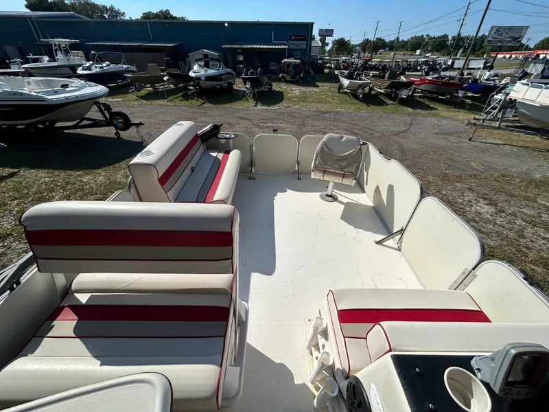 Slide: The Image of 2008 Fiesta Fish n Fun 16 Deluxe pontoon boat with spacious seating and outdoor setting. - 14