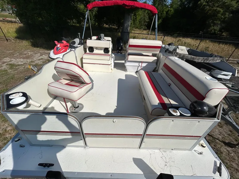Slide: The Image of 2008 Fiesta Fish n Fun 16 Deluxe pontoon boat with red and white seating. - 6