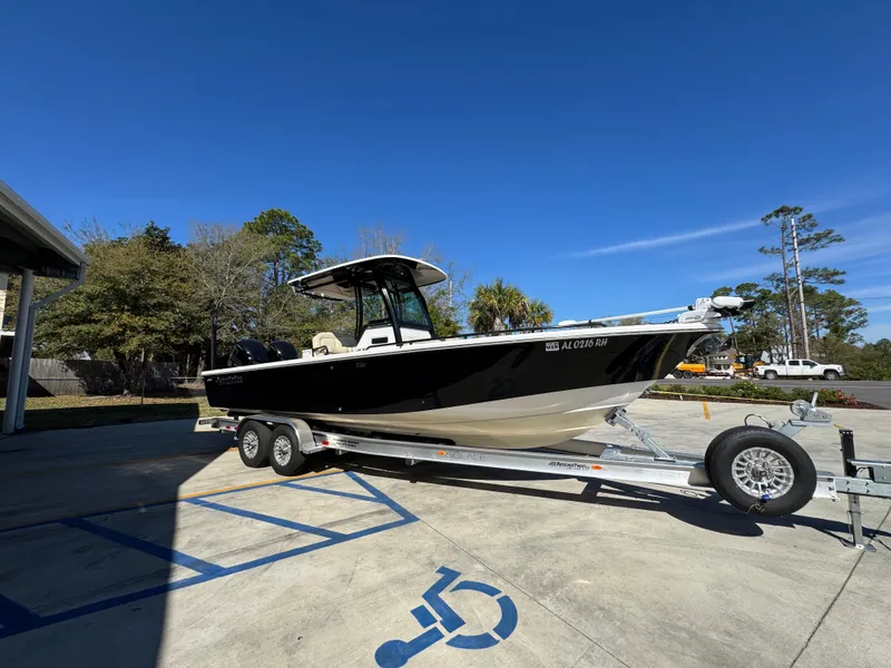Slide: The Image of 2017 Everglades 273 Center Console boat on trailer in parking lot under clear blue sky. - 11