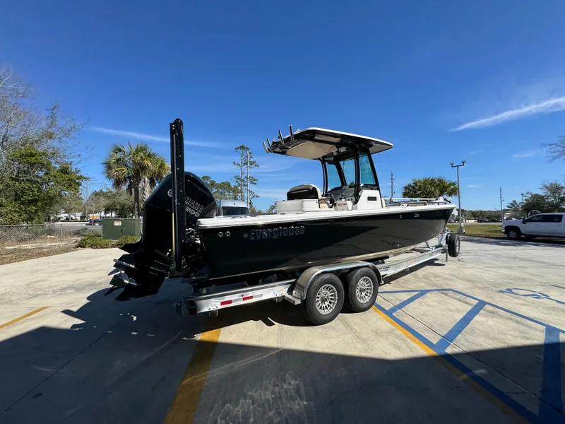 Slide: The Image of 2017 Everglades 273 Center Console boat on trailer in sunny parking lot. - 16