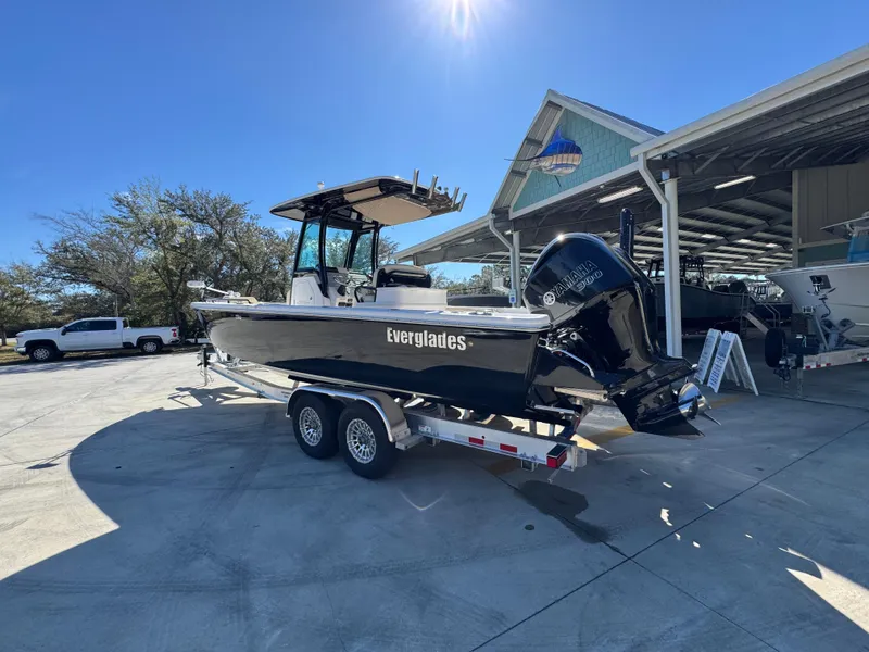 Slide: The Image of 2017 Everglades 273 Center Console boat on trailer in sunny outdoor setting. - 21