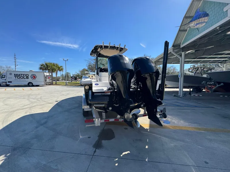 Slide: The Image of 2017 Everglades 273 Center Console boat with dual engines on a trailer. - 22