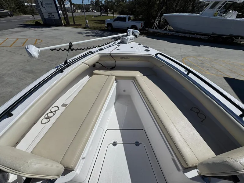 Slide: The Image of 2017 Everglades 273 Center Console boat with beige seating and trolling motor. - 24