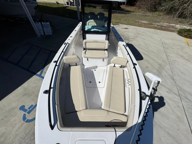 Slide: The Image of 2017 Everglades 273 Center Console boat with beige seating, docked on concrete. - 26