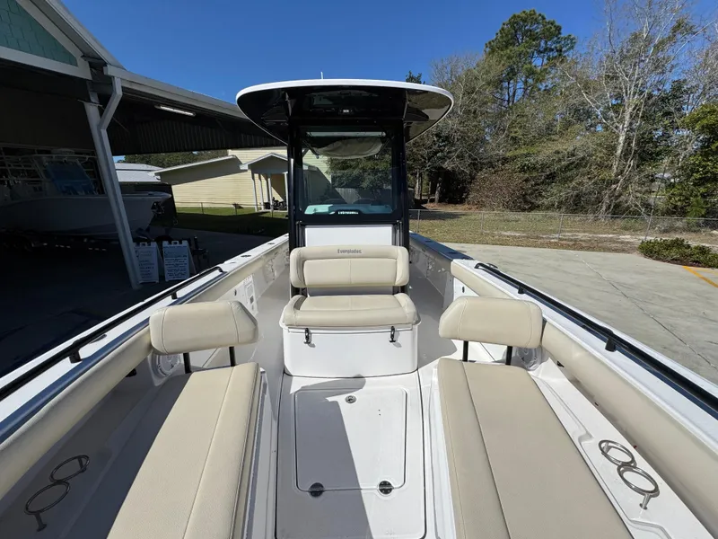 Slide: The Image of 2017 Everglades 273 Center Console boat with beige seating and spacious deck. - 28