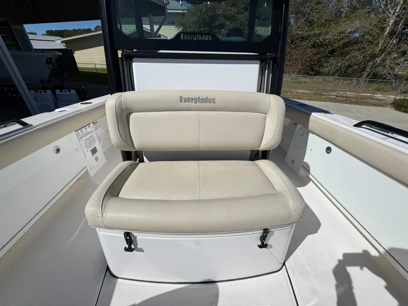 Slide: The Image of 2017 Everglades 273 Center Console boat seat, beige upholstery, outdoor setting. - 29