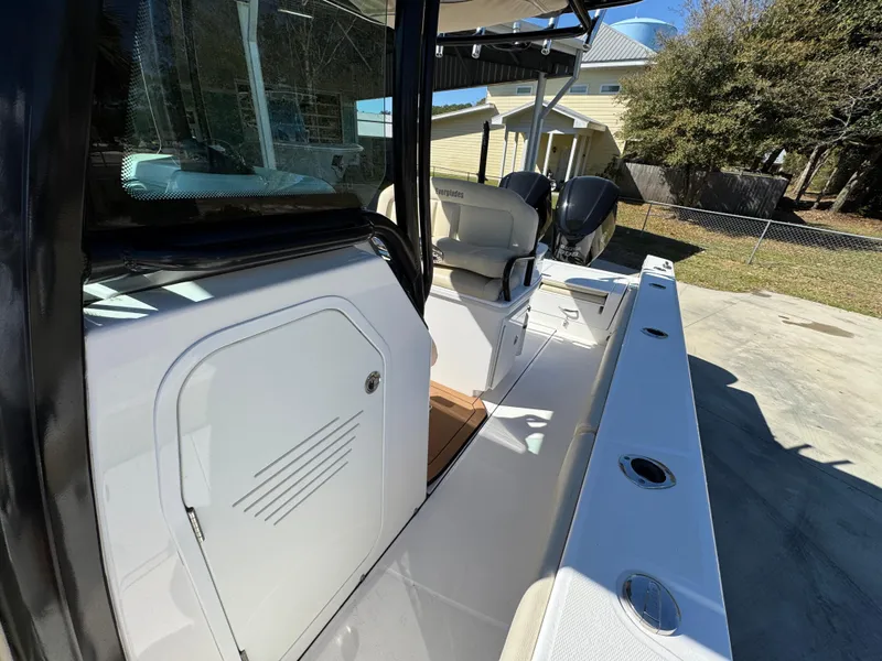 Slide: The Image of 2017 Everglades 273 Center Console boat, featuring sleek design and dual engines. - 31