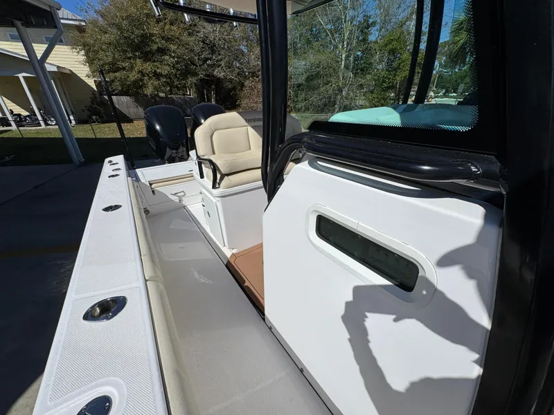Slide: The Image of 2017 Everglades 273 Center Console boat interior with seating and console details. - 32