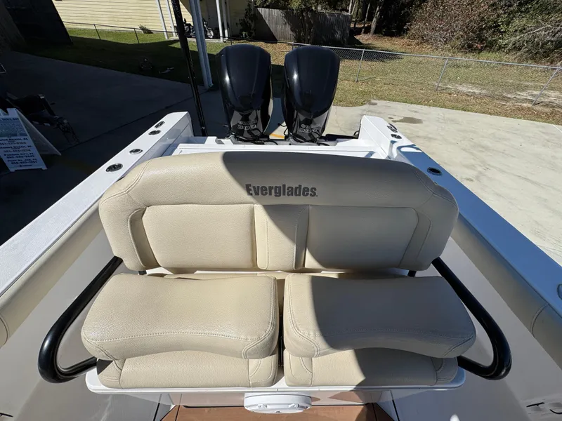 Slide: The Image of 2017 Everglades 273 Center Console boat with dual engines and cushioned seating. - 36