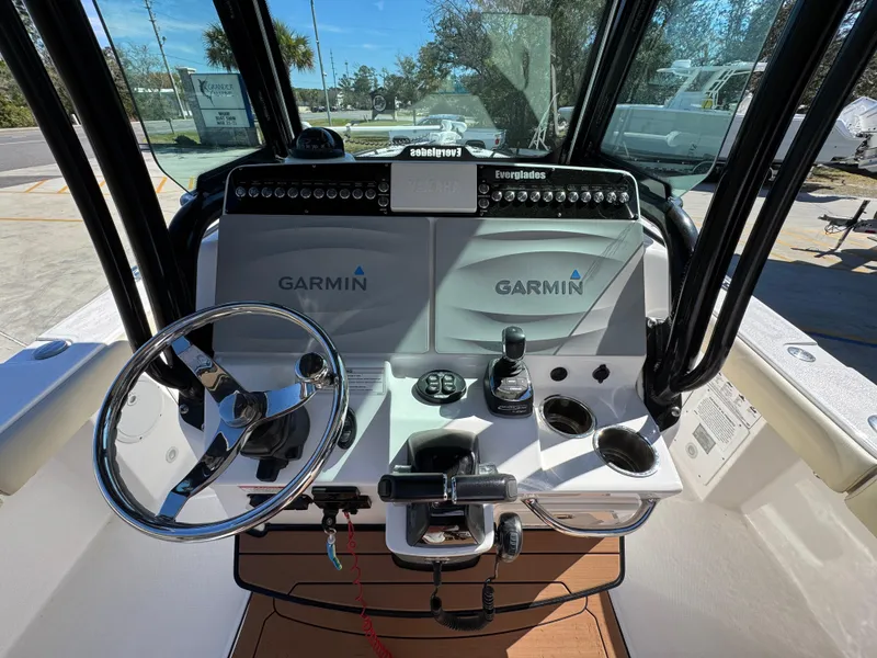 Slide: The Image of 2017 Everglades 273 Center Console boat dashboard with Garmin navigation system. - 38