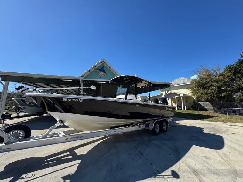 Slide: The Image of 2017 Everglades 273 Center Console boat on trailer under clear blue sky. - 4