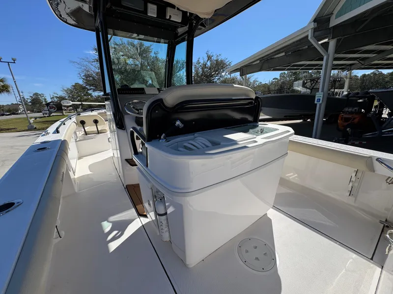 Slide: The Image of 2017 Everglades 273 Center Console boat interior with seating and console. - 40