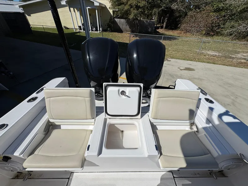 Slide: The Image of 2017 Everglades 273 Center Console boat with dual engines and seating area. - 44