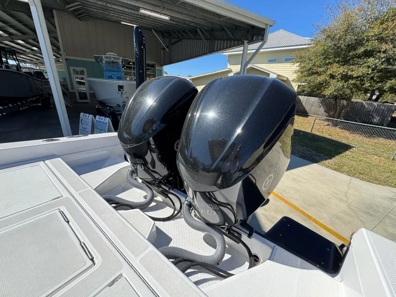 Slide: The Image of Twin outboard engines on a 2017 Everglades 273 Center Console boat. - 45