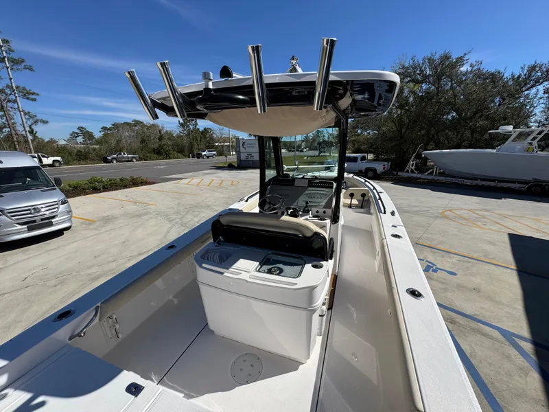 Slide: The Image of 2017 Everglades 273 Center Console boat with spacious deck and modern controls. - 47