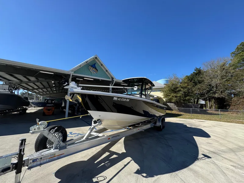 Slide: The Image of 2017 Everglades 273 Center Console boat on trailer under clear blue sky. - 6