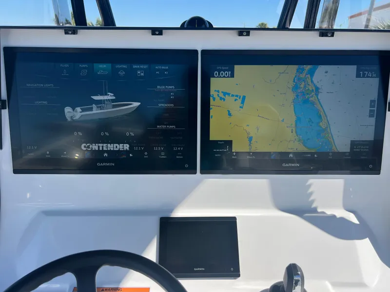 Slide: The Image of 2025 Contender 35 ST boat dashboard with dual Garmin navigation screens. - 10