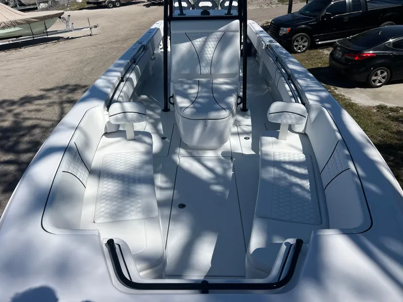 Slide: The Image of 2025 Contender 35 ST boat interior with white seating and sleek design. - 13