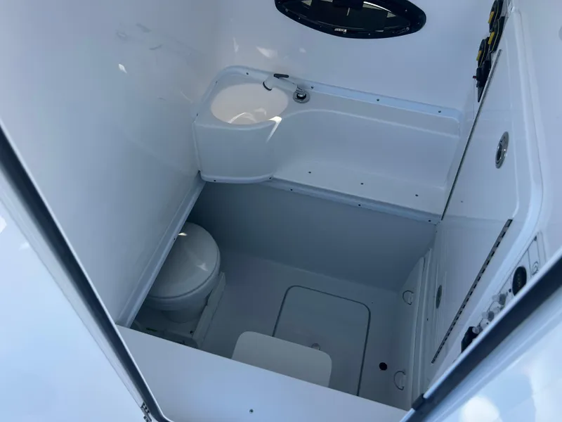 Slide: The Image of 2025 Contender 35 ST boat interior bathroom with sink and toilet. - 17
