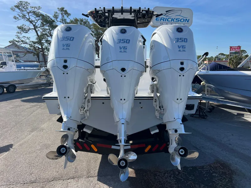 Slide: The Image of 2025 Contender 35 ST boat with triple 350 V6 engines, rear view. - 20