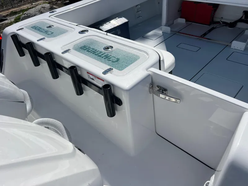 Slide: The Image of 2025 Contender 35 ST boat deck with rod holders and storage compartments. - 5