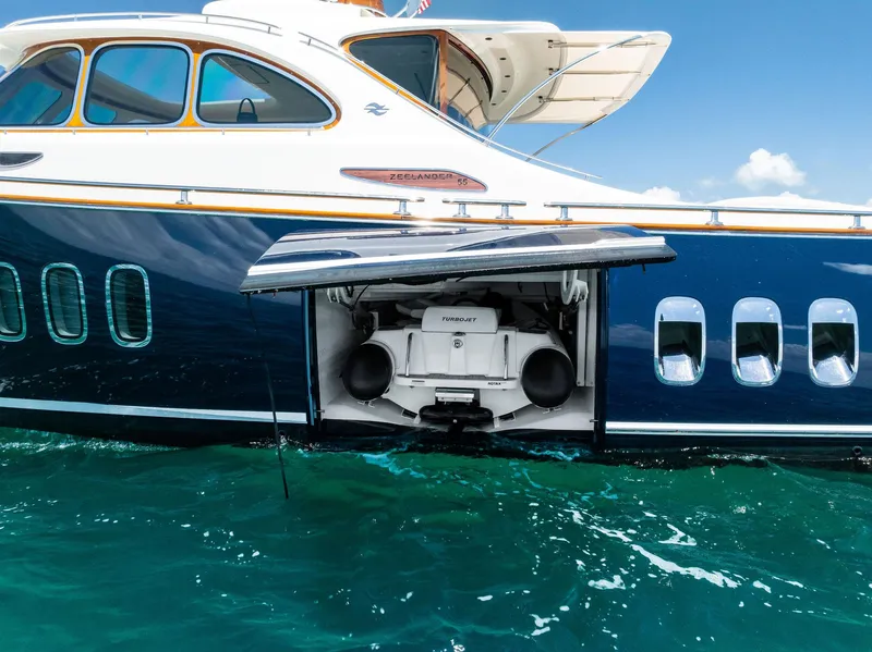 Slide: The Image of 2019 Zeelander 55 yacht with open side compartment on turquoise water. - 13