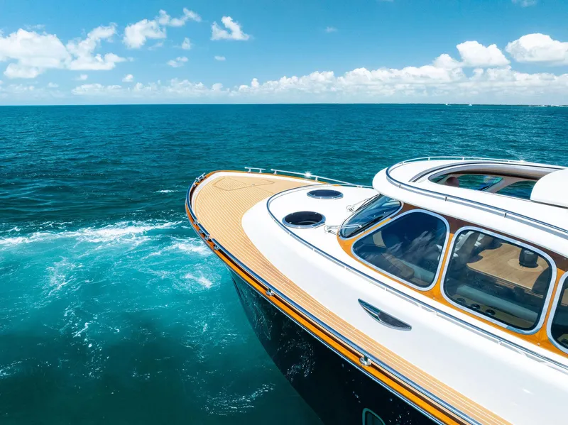 Slide: The Image of Zeelander 55 yacht cruising on open sea under clear blue sky, 2019 model. - 14