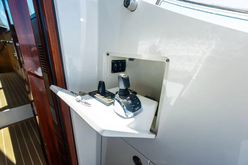 Slide: The Image of Control panel on 2019 Zeelander 55 yacht, featuring joystick and switches. - 24