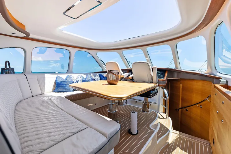 Slide: The Image of Luxurious interior of 2019 Zeelander 55 yacht with elegant seating and panoramic windows. - 33