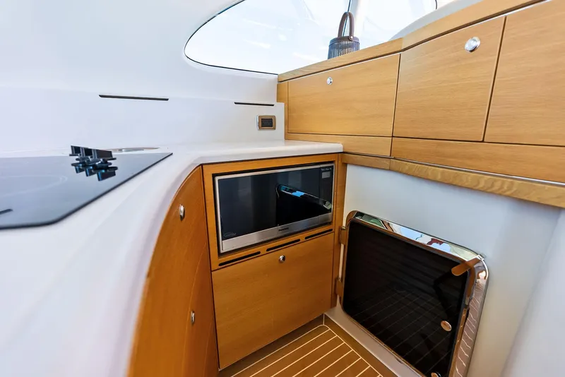 Slide: The Image of Interior of 2019 Zeelander 55 yacht with modern kitchen cabinetry and appliances. - 37