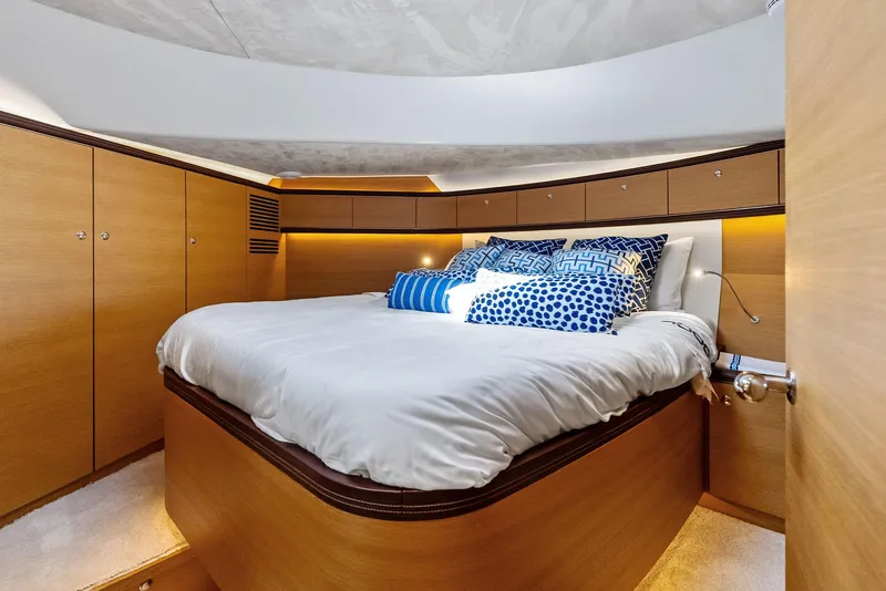 Slide: The Image of Luxurious bedroom interior of 2019 Zeelander 55 yacht with elegant wood finish and cozy bedding. - 43