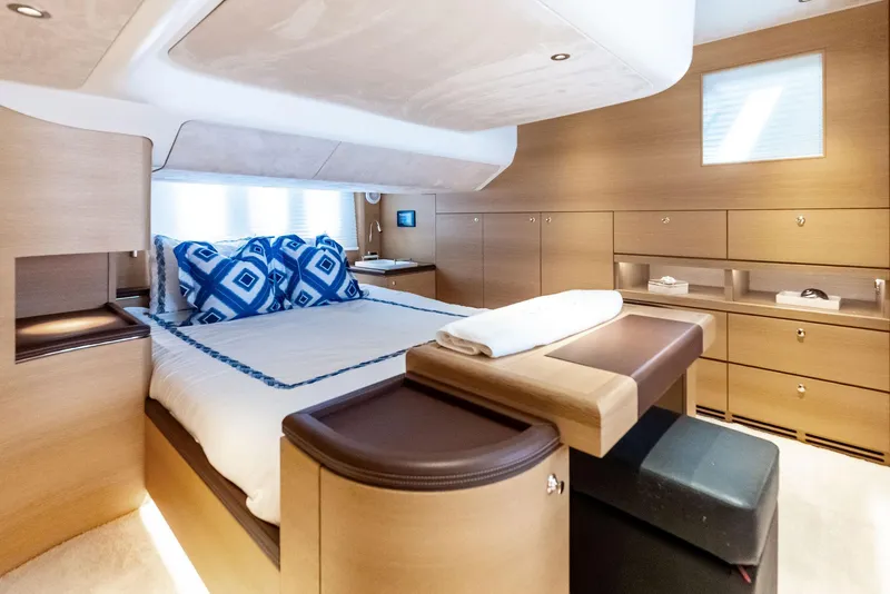 Slide: The Image of Luxurious interior of 2019 Zeelander 55 yacht with elegant wood finish and plush bedding. - 47