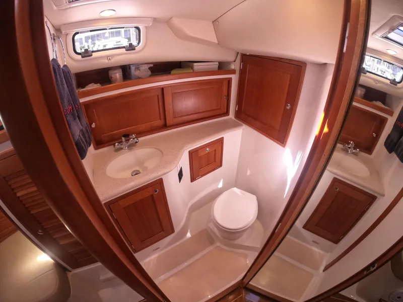Slide: The Image of 2018 MJM 35z yacht bathroom with wooden cabinets and modern fixtures. - 25