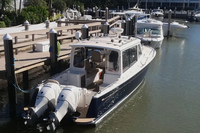 Slide: The Image of 2018 MJM 35z boat docked with twin outboard engines. - 5