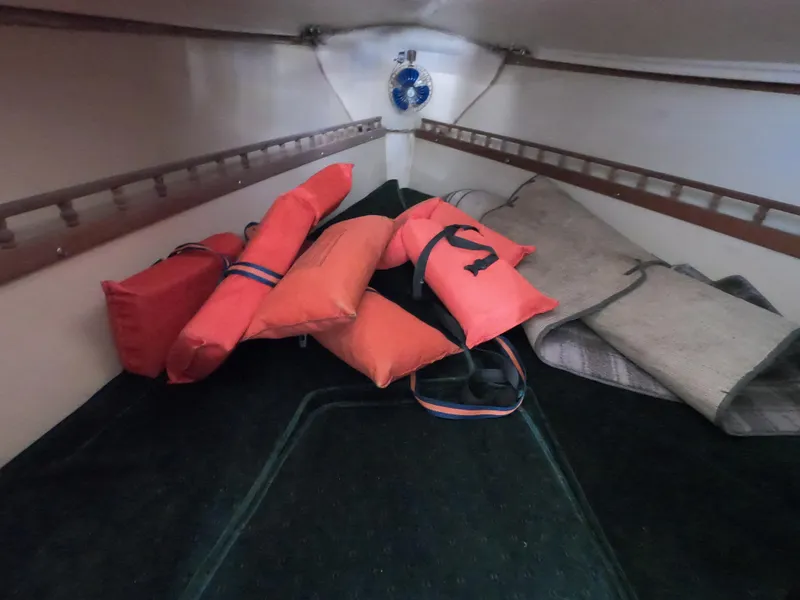 Slide: The Image of Interior of 1983 Catalina 27 sailboat with life jackets and cushions. - 13