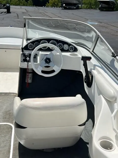 Slide: The Image of 2001 Wellcraft 175SS boat cockpit with steering wheel and dashboard controls. - 5