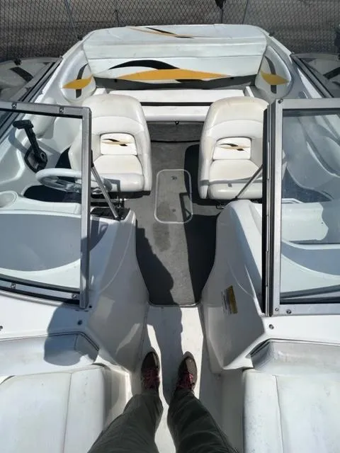 Slide: The Image of 2001 Wellcraft 175SS boat interior with white seating and open windshield. - 7