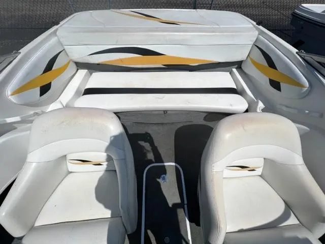 Slide: The Image of 2001 Wellcraft 175SS boat interior with white and yellow seating. - 8