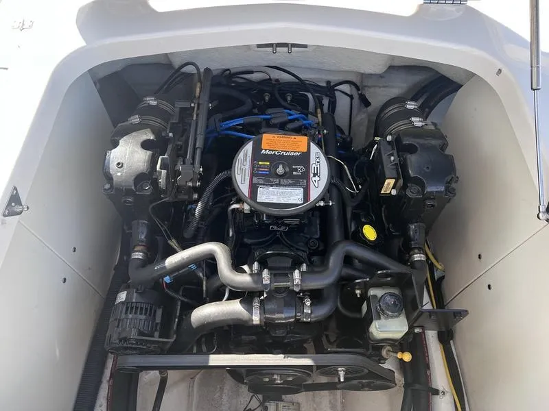 Slide: The Image of Engine compartment of a 2012 Chaparral 196 SSi boat, featuring a MerCruiser engine. - 23
