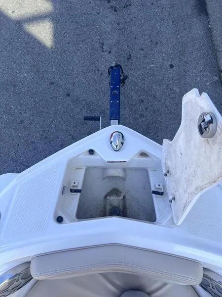 Slide: The Image of 2012 Chaparral 196 SSi boat bow with open storage compartment on trailer. - 9